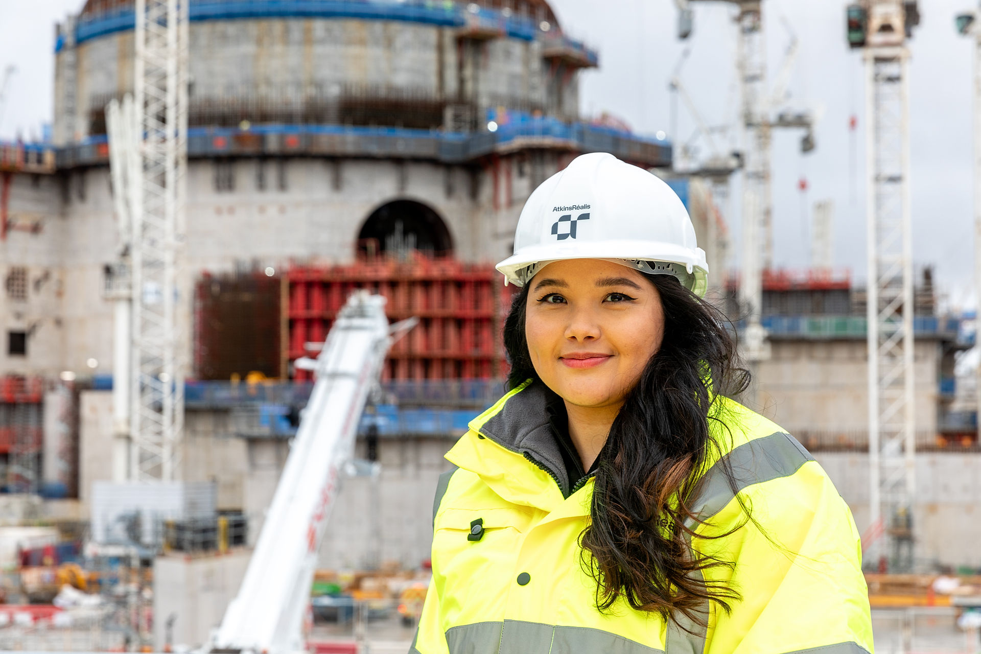 young female engineer in atkinsrealis ppe onsite at a nuclear power station
